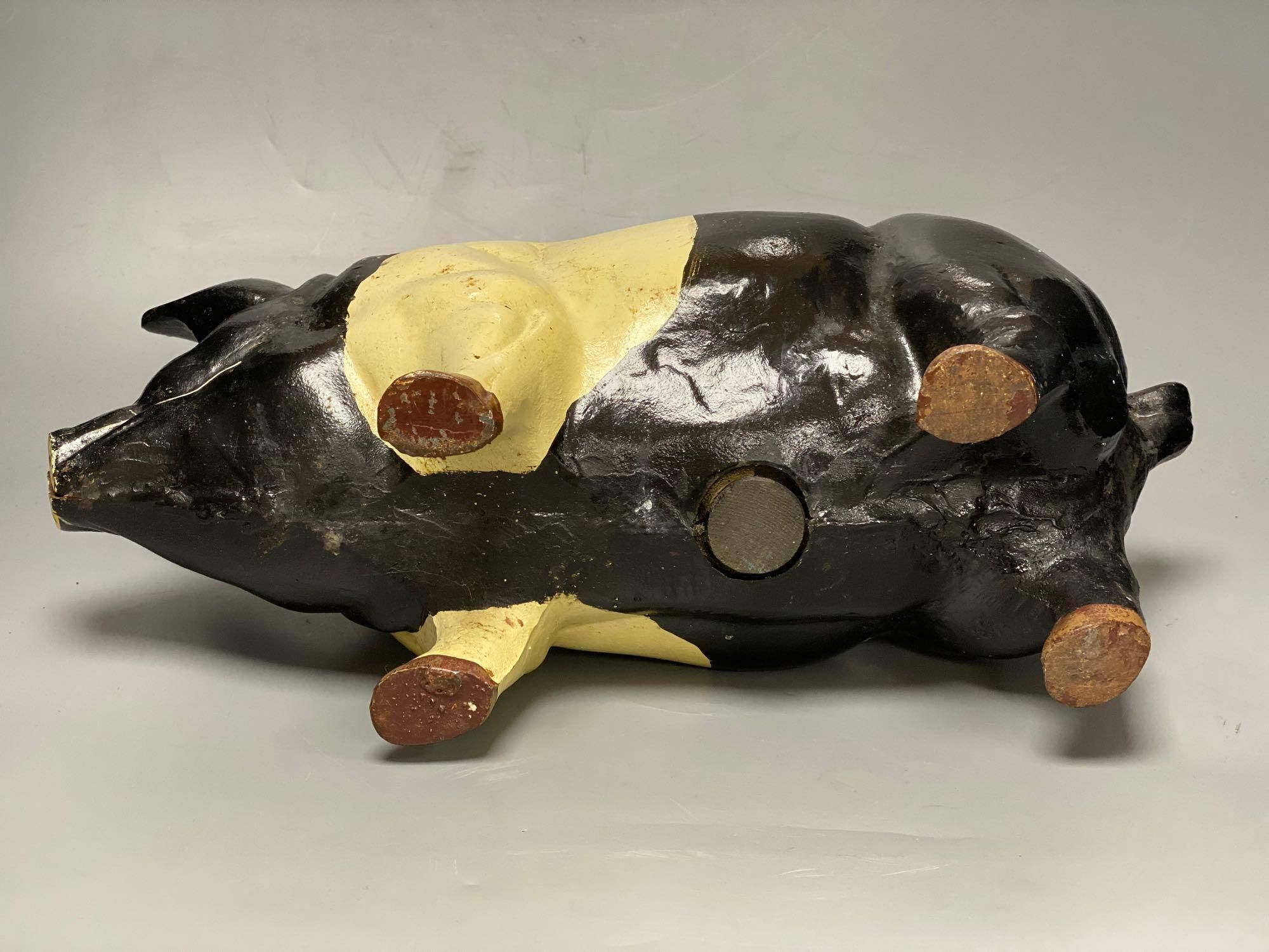 A large heavy cast iron saddle back pig money bank, circa 1950s, length 46cm